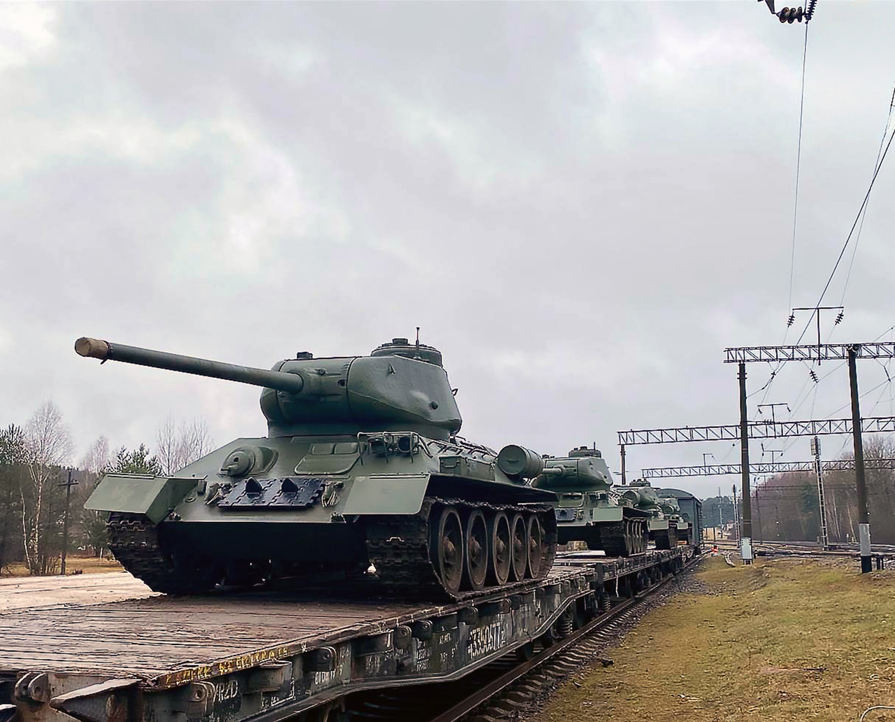 3 - Photographs of a troop train carrying T-34 tanks intended for a military parade being unloaded at Ozerishche station